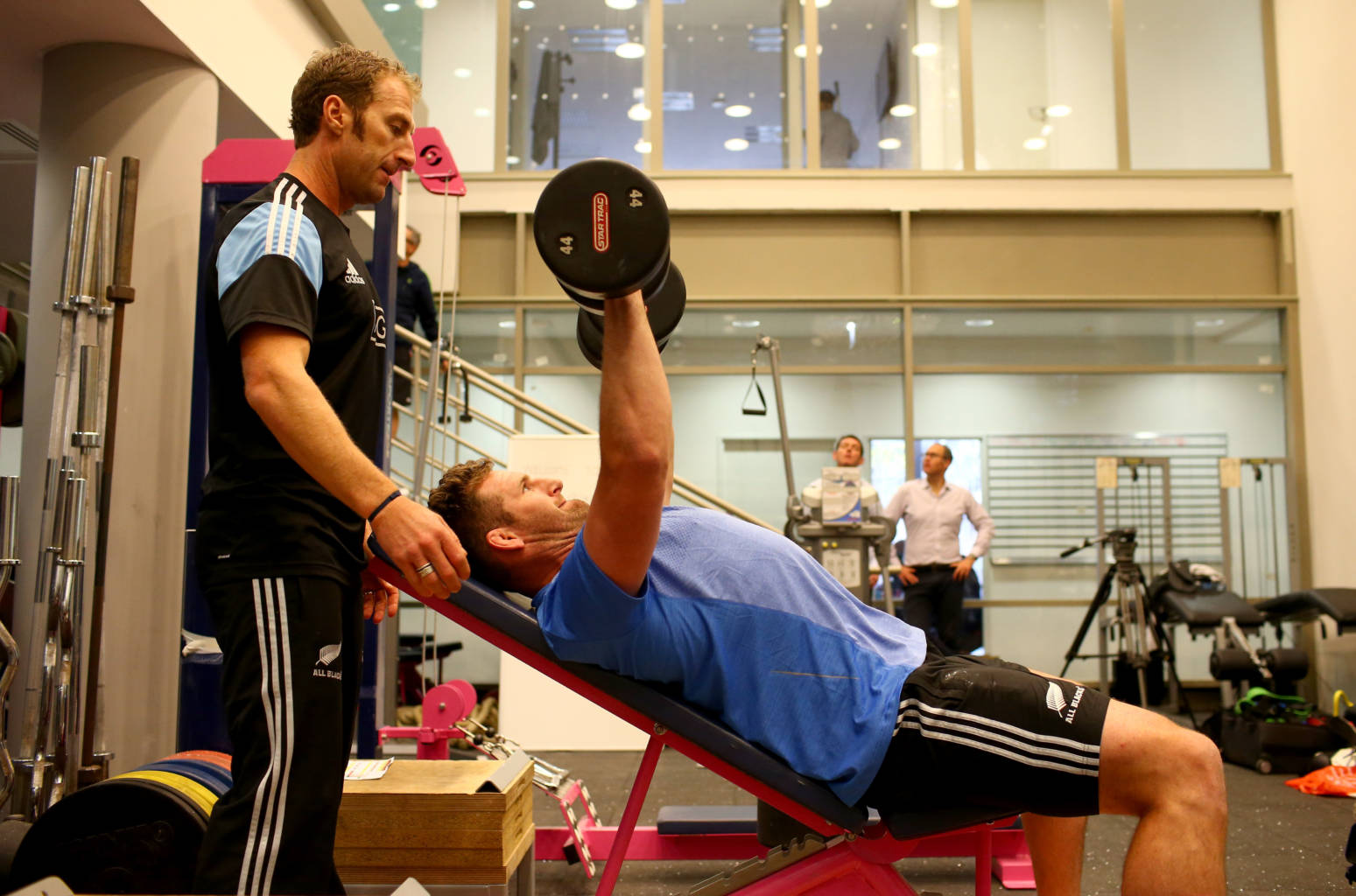 PARIS, FRANCE - NOVEMBER 04:  Kieran Read of the All Blacks lifts weights with assistance from trainer Nic Gill during a New Zealand All Blacks gym session at the Stade Jean Bouin on November 4, 2013 in Paris, France.  (Photo by Phil Walter/Getty Images)