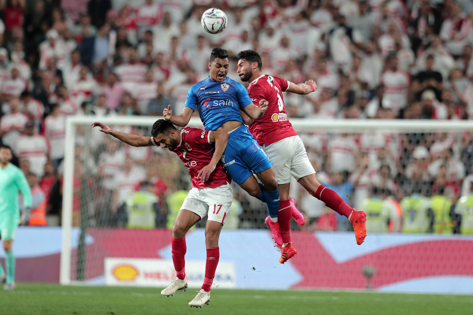Ahly's midfielder Amr el-Solia (L) and defender Yasser Ibrahim (R) vie for a header against Zamalek's forward Mostafa Mohamed (C) during the Egyptian Super Cup final football match between Ahly SC and Zamalek SC at Mohammed Bin Zayed stadium in Abu Dhabi on February 20, 2020. (Photo by Mahmoud KHALED / AFP) (Photo by MAHMOUD KHALED/AFP via Getty Images)